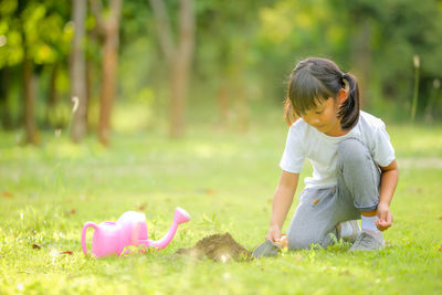 Rear view of girl on field