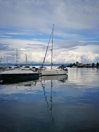 Boats moored at harbor