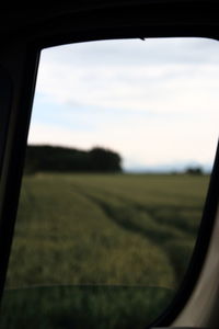 View of landscape through car window