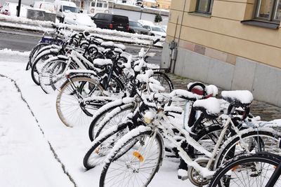Bicycles parked on street during winter