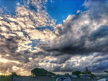 Storm clouds over blue sky