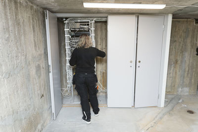 Female electrician at work