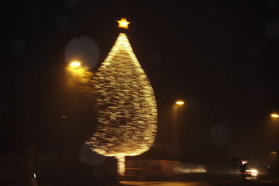 Illuminated street light at night