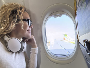 Portrait of young woman using mobile phone