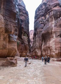 People walking on rocks