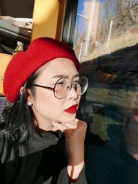 Portrait of young woman wearing hat