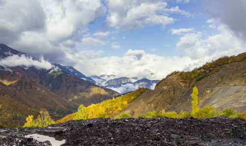 Scenic view of landscape and mountains against sky