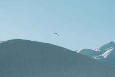 Paragliding in winter in the mountains