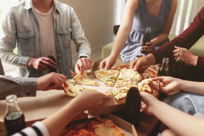 Midsection of people preparing food