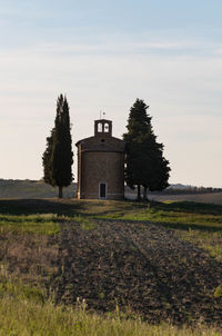 House on field against sky