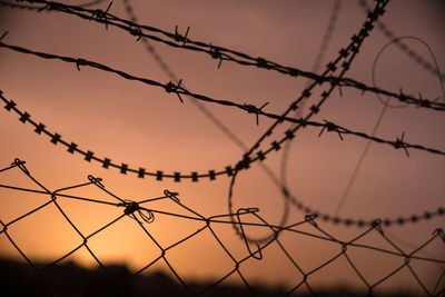 Barbed wire and sunset in bethlehem, land of palestinian and israeli issues