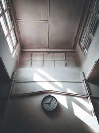 Low angle view of clock on ceiling