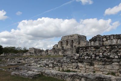 Old ruins of building against cloudy sky