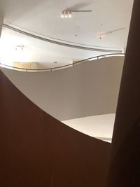 Low angle view of illuminated light against ceiling of building