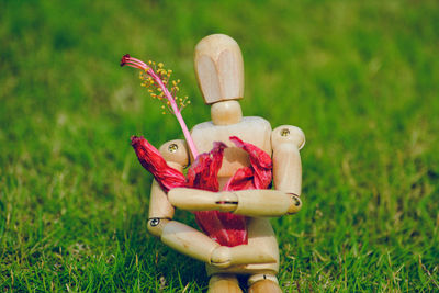 Close-up of stuffed toy on field