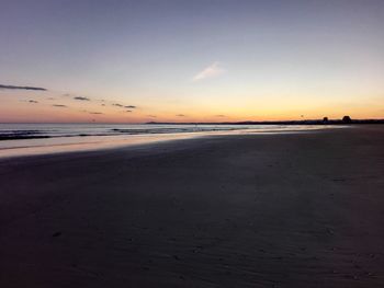 Scenic view of beach at sunset