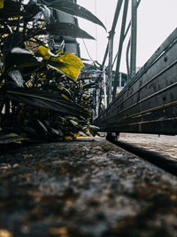 Surface level of bridge against sky in city