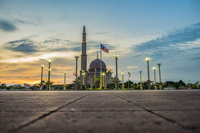 View of mosque against cloudy sky