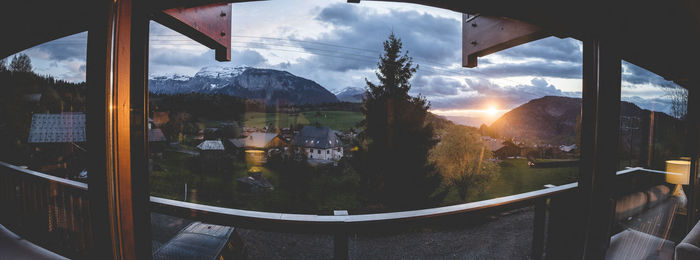 Scenic view of sunset seen through glass window