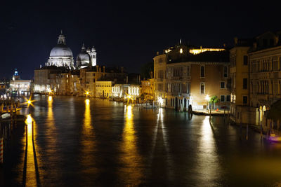 Illuminated buildings in city at night