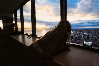 Rear view of woman overlooking cityscape