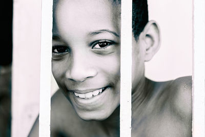 Close-up portrait of smiling young woman