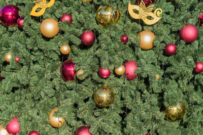 Christmas and new year holidays background. christmas tree decorated with balls and garlands