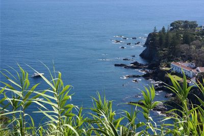 Scenic view of sea against blue sky