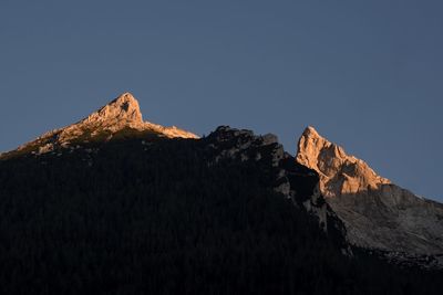 Scenic view of rocky mountains against clear sky