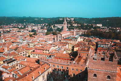 Sunny day in verona, italy. view from above on old town red roofs, square, streets and landmarks.