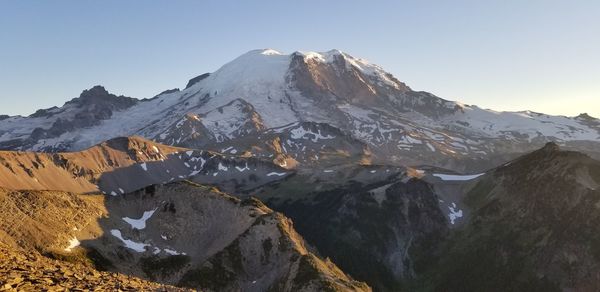 Scenic view of snowcapped mountains against clear sky