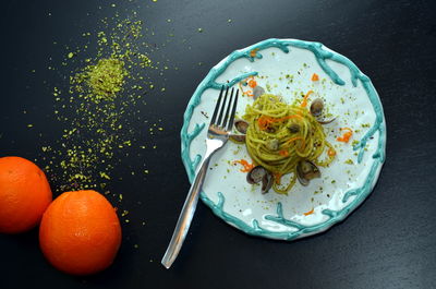 Dish of spaghetti with seafood and pistachios. typical sicilian cuisine, the tradition of the diet