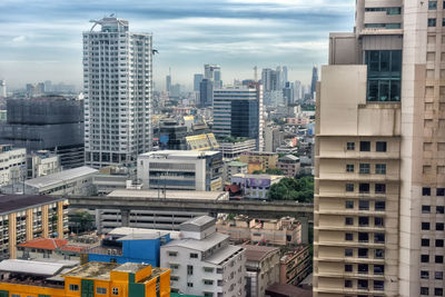 High angle view of buildings in city against sky