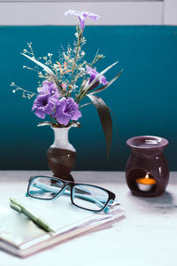 Close-up of purple flowers in vase on table