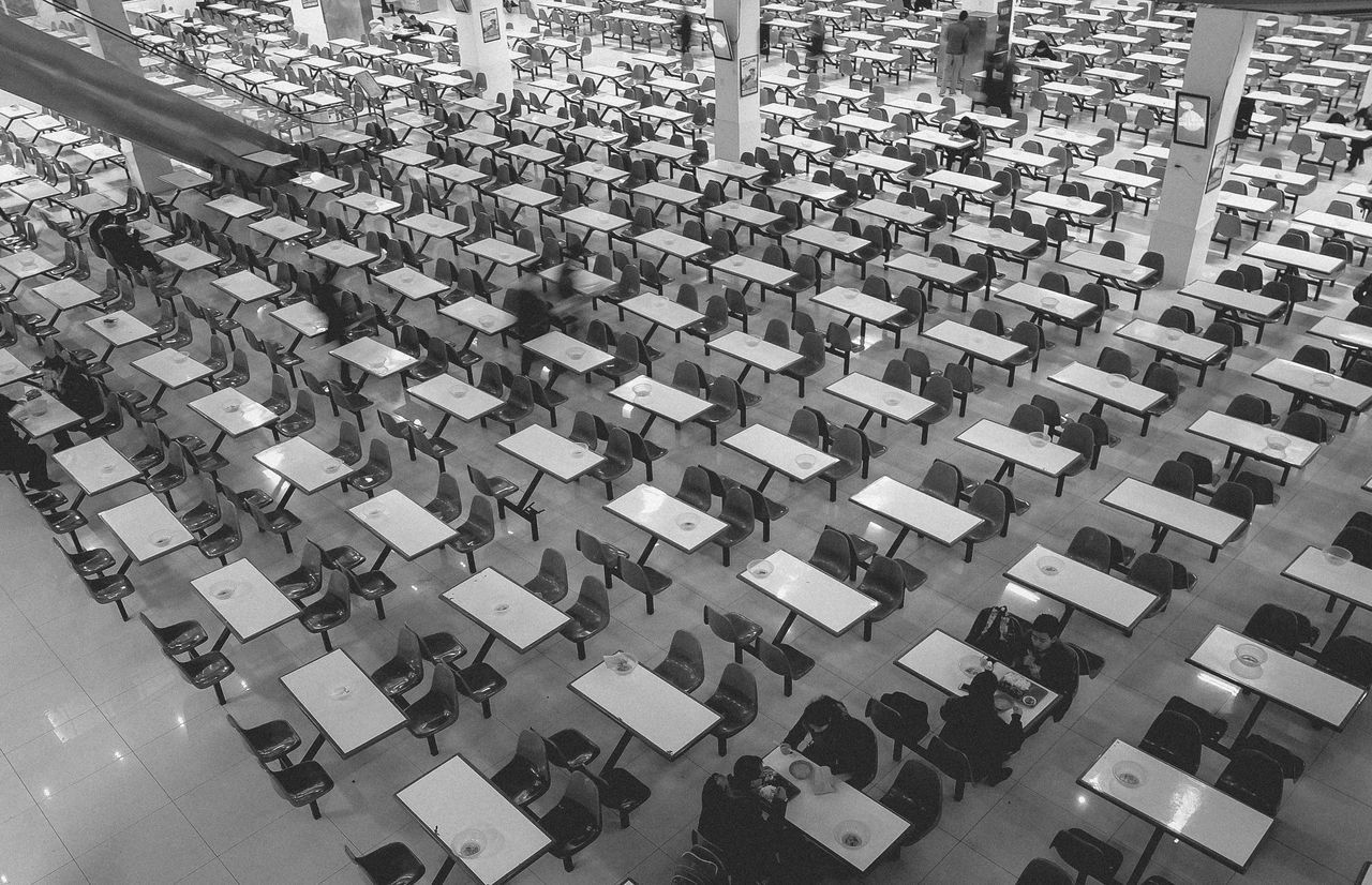 arrangement, in a row, large group of objects, seat, day, no people, outdoors, auditorium