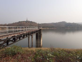 Bridge over river against clear sky