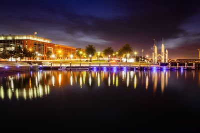 Illuminated buildings by river against sky at night geelong waterfront