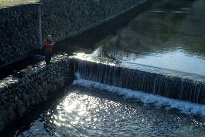 Man surfing in river