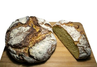Directly above shot of bread on table against white background