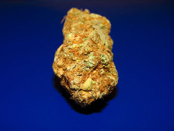 Close-up of rock against blue background