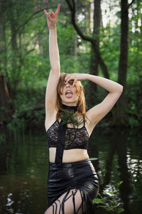 Full length of a young woman in lake