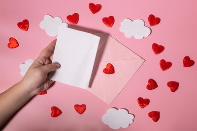 Cropped hand of woman holding gift