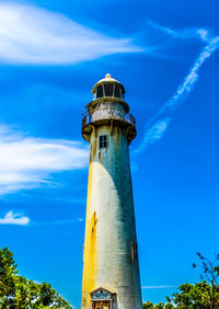 Low angle view of lighthouse against blue sky