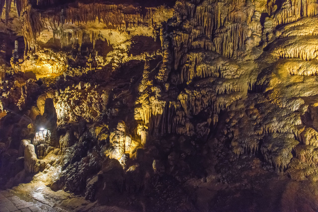 FULL FRAME SHOT OF ILLUMINATED ROCK FORMATION