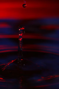 Close-up of drop splashing on water surface