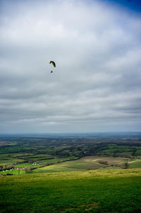 Scenic view of green landscape against sky