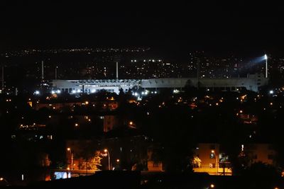 High angle view of illuminated buildings in city at night