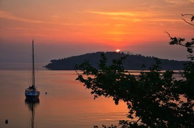 Scenic view of river at sunset