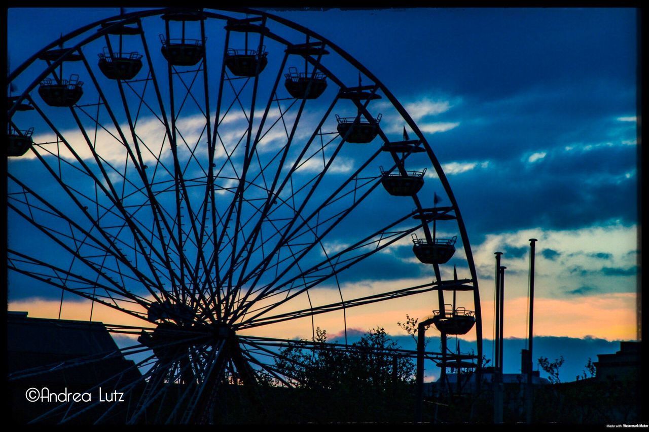 LOW ANGLE VIEW OF FERRIS WHEEL AGAINST BLUE SKY