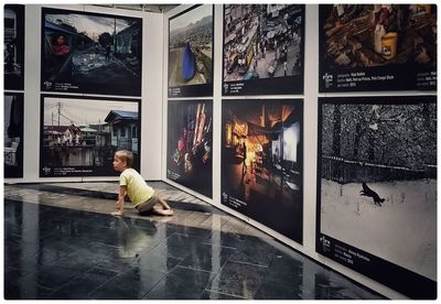 Full length of boy photographing in water